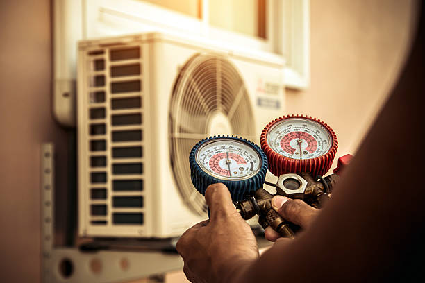 Professional Heat Pump Repair technician working in Rossville, IN